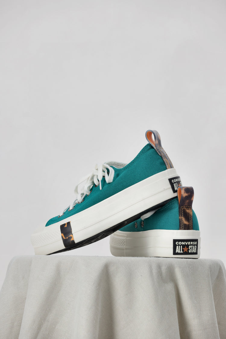 Peacock hot sale converse sneakers